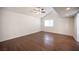 This spacious bedroom offers natural lighting, beautiful flooring, and crisp, neutral paint at 3369 Milenko Dr, Las Vegas, NV 89121
