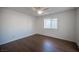 Spacious bedroom with a ceiling fan, laminate flooring, and a window at 3369 Milenko Dr, Las Vegas, NV 89121