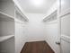 Walk-in closet with ample shelving and laminate floors, offering plenty of storage at 3369 Milenko Dr, Las Vegas, NV 89121
