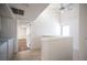 Bright hallway features neutral paint, a ceiling fan, and an open doorway to another room at 3369 Milenko Dr, Las Vegas, NV 89121