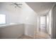 Bright hallway with hardwood floors, overhead lighting, and a ceiling fan providing a welcoming transition between rooms at 3369 Milenko Dr, Las Vegas, NV 89121