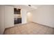 This living area features a convenient wet bar and neutral tile flooring at 3369 Milenko Dr, Las Vegas, NV 89121