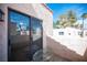 Outdoor patio area with an outdoor glass table and view of the desert landscape at 3369 Milenko Dr, Las Vegas, NV 89121