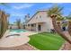 Outdoor living is enhanced by a pool, spa, patio, grass and mature landscaping at 3588 Franciscan Ln, Las Vegas, NV 89121
