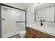 Updated bathroom featuring a glass shower, stone floors, and modern vanity at 3588 Franciscan Ln, Las Vegas, NV 89121