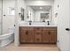 Bathroom with double vanity and wood cabinets at 3588 Franciscan Ln, Las Vegas, NV 89121