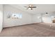 Expansive bedroom featuring multiple windows and ceiling fans at 3588 Franciscan Ln, Las Vegas, NV 89121