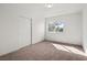 Bright bedroom with carpet, white walls, a window and a closet with sliding doors at 3588 Franciscan Ln, Las Vegas, NV 89121