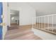 Bright entryway with light wood floors, white walls, and staircase at 3588 Franciscan Ln, Las Vegas, NV 89121