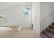 Light-filled entryway featuring a contemporary chandelier and staircase at 3588 Franciscan Ln, Las Vegas, NV 89121