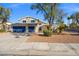 Inviting two-story home featuring a two-car garage and desert landscaping at 3588 Franciscan Ln, Las Vegas, NV 89121