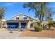 Inviting two-story home featuring a two-car garage and desert landscaping at 3588 Franciscan Ln, Las Vegas, NV 89121