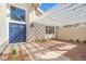 Attractive front entrance featuring blue double doors and a shaded patio area at 3588 Franciscan Ln, Las Vegas, NV 89121