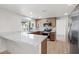 Open kitchen with stainless steel appliances, an island, and breakfast bar at 3588 Franciscan Ln, Las Vegas, NV 89121