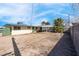 Large backyard featuring a covered patio and plenty of open space at 3709 Perliter Ave, North Las Vegas, NV 89030