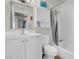 A well-lit bathroom with a single sink vanity and shower-tub combo at 3709 Perliter Ave, North Las Vegas, NV 89030