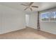Bedroom showcasing tile floors and a window with patterned curtains at 3709 Perliter Ave, North Las Vegas, NV 89030