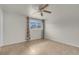 Bedroom featuring tile floors and a window providing natural light at 3709 Perliter Ave, North Las Vegas, NV 89030
