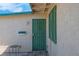Inviting front entrance with a secure metal door and window at 3709 Perliter Ave, North Las Vegas, NV 89030