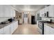 Spacious kitchen features white cabinets, granite countertops, and stainless steel appliances at 3709 Perliter Ave, North Las Vegas, NV 89030