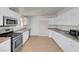 Bright kitchen features white cabinets, granite countertops, and stainless steel appliances at 3709 Perliter Ave, North Las Vegas, NV 89030
