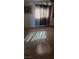 Living room with tile flooring, natural light, and a cabinet at 3709 Perliter Ave, North Las Vegas, NV 89030