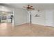 Living room view featuring tile floors, a ceiling fan, and an open layout at 3709 Perliter Ave, North Las Vegas, NV 89030