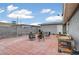 Tiled backyard with seating and secure fence, perfect for outdoor entertaining at 4102 Calimesa St, Las Vegas, NV 89115