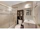 Bathroom featuring a toilet, sink, and shower with glass doors at 4102 Calimesa St, Las Vegas, NV 89115