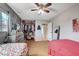 Spacious bedroom with wood-look floors and a closet packed with clothes and accessories at 4102 Calimesa St, Las Vegas, NV 89115