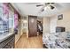 Cozy bedroom with hardwood floors, a closet, and a dresser, providing ample storage and organization space at 4102 Calimesa St, Las Vegas, NV 89115