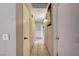 Neutral hallway with multiple doors and tile flooring creates a sense of flow and connection between rooms at 4102 Calimesa St, Las Vegas, NV 89115