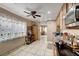 Bright kitchen with tile floors, natural wood cabinetry, stainless steel appliances, and an open view to the living spaces at 4102 Calimesa St, Las Vegas, NV 89115