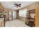 Traditional kitchen with tile floors, stainless steel refrigerator, and dark cabinetry with an eat-in space at 4102 Calimesa St, Las Vegas, NV 89115
