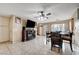Spacious living area featuring a dining table, tiled floors, and a ceiling fan for comfort at 4102 Calimesa St, Las Vegas, NV 89115
