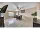 Open living and dining area with tile flooring and natural light streaming through the windows at 4102 Calimesa St, Las Vegas, NV 89115