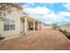 Spacious backyard patio features a covered area, hardscape, and ample room for outdoor entertaining at 430 Nancy Dr, Henderson, NV 89015