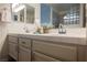 Bathroom featuring dual sinks with modern fixtures and bright lighting at 430 Nancy Dr, Henderson, NV 89015