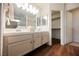 Bathroom featuring dual sinks, tile countertops and walk-in closet at 430 Nancy Dr, Henderson, NV 89015