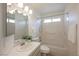 A clean white bathroom with a shower-tub combo and tile countertop at 430 Nancy Dr, Henderson, NV 89015