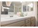 Bathroom with dual sinks, bright lighting and decorative finishes at 430 Nancy Dr, Henderson, NV 89015