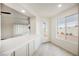 Bright breakfast bar with tile counter, perfect for casual dining and entertaining at 430 Nancy Dr, Henderson, NV 89015