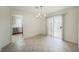 Open dining area with tile floors and sliding glass doors to the backyard at 430 Nancy Dr, Henderson, NV 89015