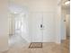 Welcoming entryway with tile flooring, double doors, and views into living spaces at 430 Nancy Dr, Henderson, NV 89015