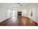 Spacious living room with stone fireplace, ceiling fan, and views to kitchen and backyard at 430 Nancy Dr, Henderson, NV 89015