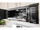 Open stainless steel microwave interior with turntable and cooking guide at 430 Nancy Dr, Henderson, NV 89015
