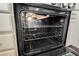 Oven interior showcases racks and interior lighting, ready for baking in a clean appliance at 430 Nancy Dr, Henderson, NV 89015