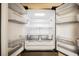 New stainless steel refrigerator with well-lit interior and adjustable shelves at 430 Nancy Dr, Henderson, NV 89015