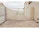 Side yard with a gated entrance and gravel surface, offering potential for customization or storage at 430 Nancy Dr, Henderson, NV 89015