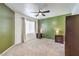 Spacious bedroom with ceiling fan, carpet, and neutral paint at 4630 Basilicata Ln # 203, North Las Vegas, NV 89084